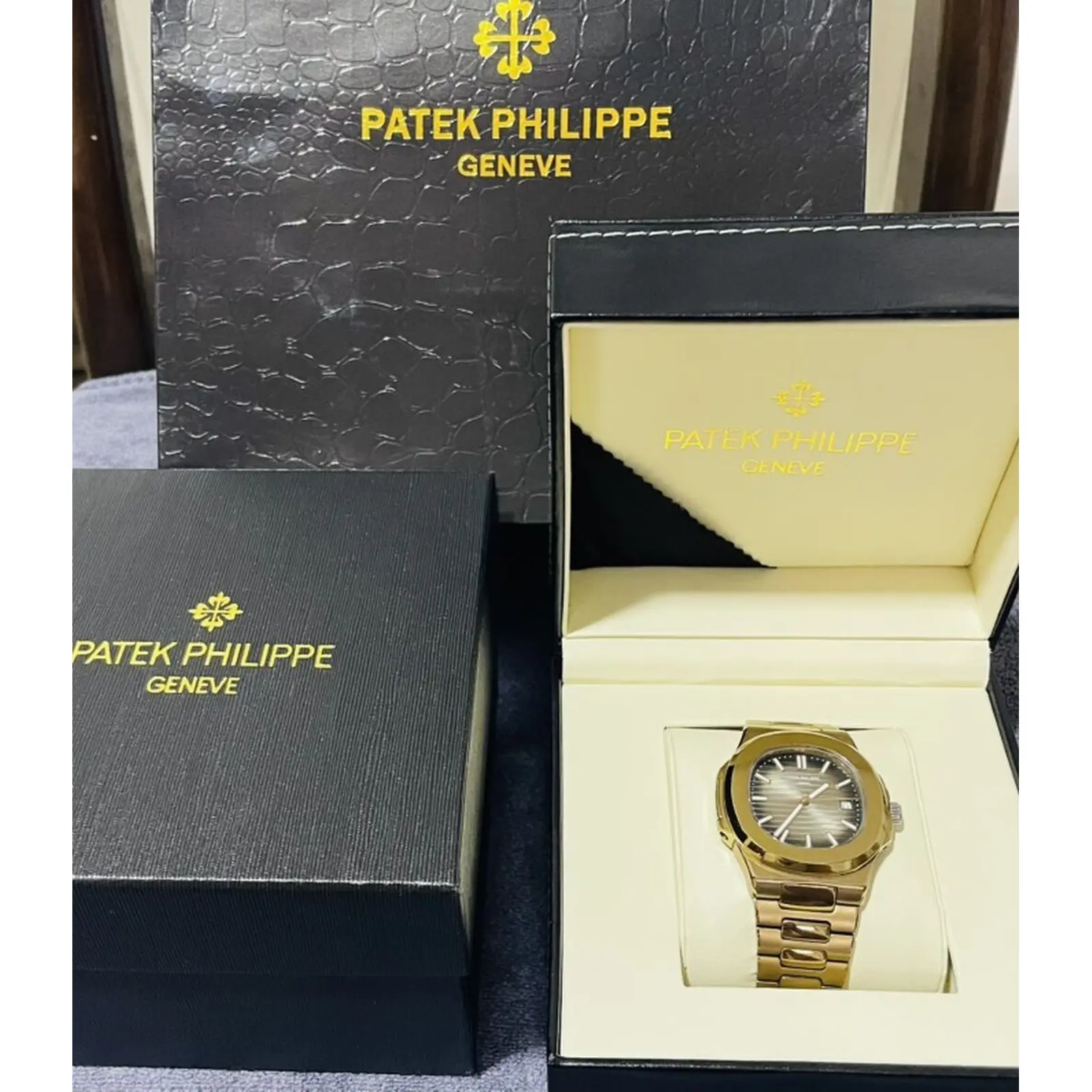 Patek Philippe Nautilus üslubunda kişi qol saatı